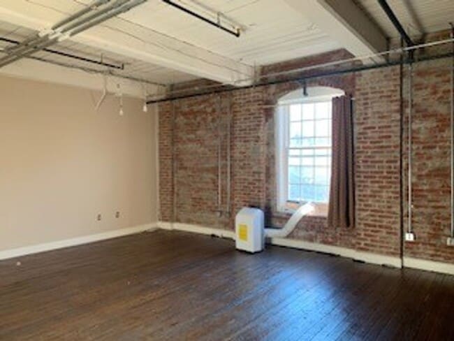 Building Photo - Downtown Studio at Riverviews — Exposed Brick & City Views