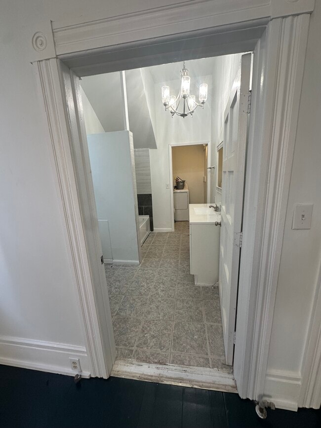 View of the bathroom and laundry room. - 111 E 39th St