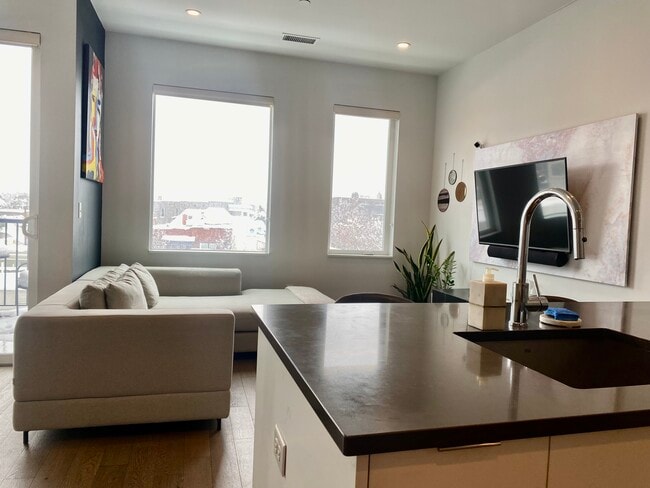 Living Room with South Facing Windows - 1300 N Ogden St Unit 401