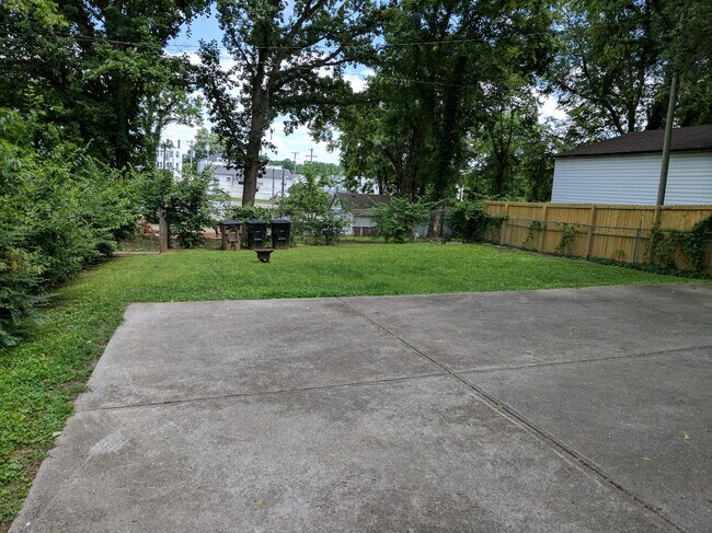 Parking area in back with backyard - 2418 Brasher Ave