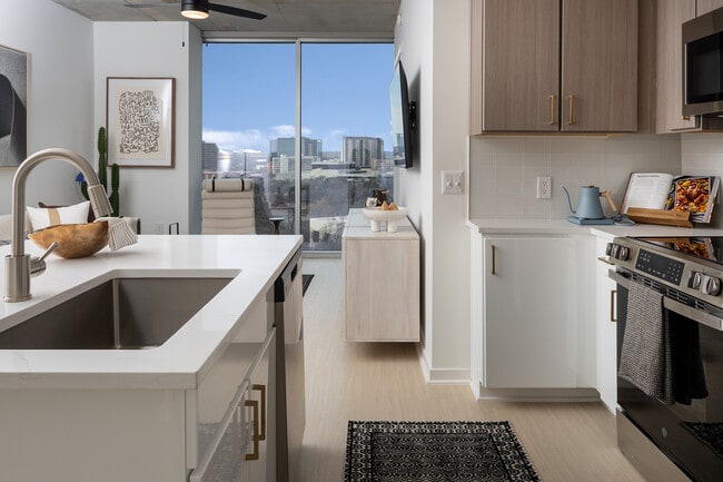 All new cabinets, calacatta gold quartz countertops and stainless steel appliances in renovated homes