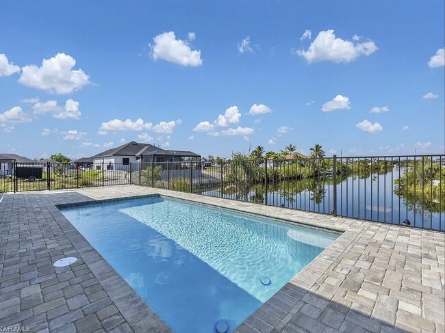 Photo - Almost New Construction Waterfront Home in NE Cape Featuring A Pool, Fenced Yard & More! COMING SOON