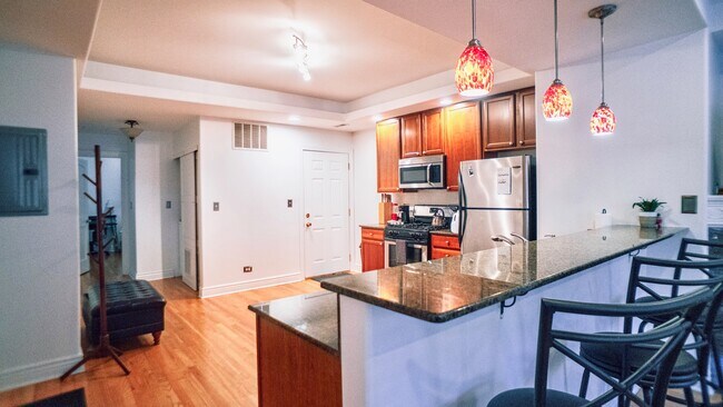 Kitchen and dining area - 6709 N Lakewood Ave Condo Unit 2S