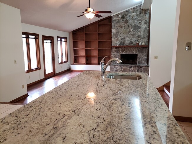 Kitchen island overlooking living area - 7415 Savannah Dr