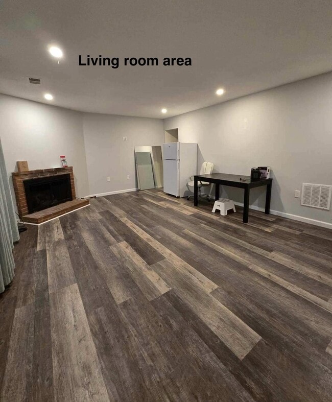 Spacious living room and dining to enjoy watching your favorite streaming service. - 4909 Casimir St Unit 1 Basement