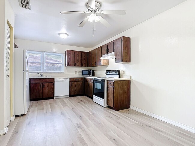 Photo - Spanish-Style 3 Bedroom, 2.5 Bath Mediterranean Rooftop Townhouse – Basic Cable & Wi-Fi Included!