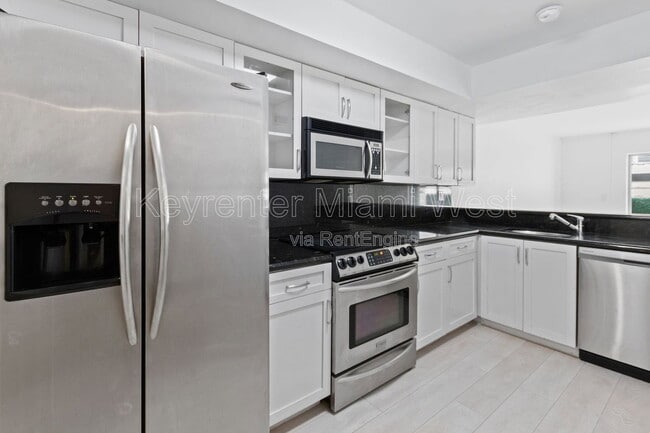 Building Photo - 2977 McFarlane Rd Unit Ph 10