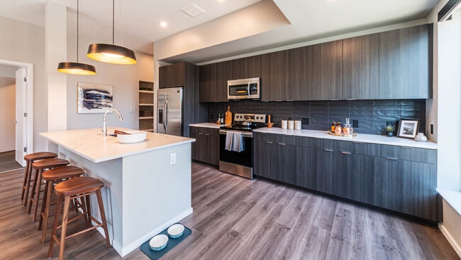 Kitchen with Stainless Steel Appliances and Breakfast Bar