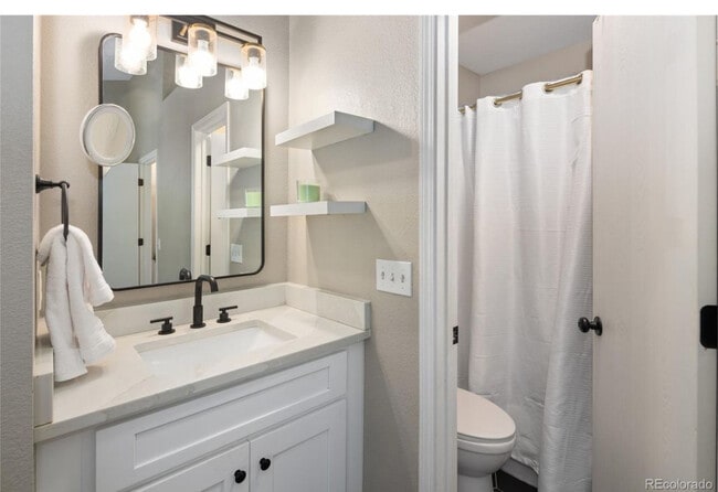 Bedroom1 bath - 10587 W Maplewood Dr