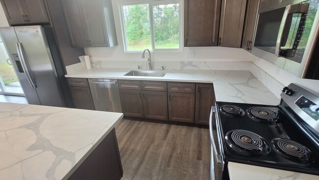 Photo - This 3-bedroom, 2-bath home in Orchidland Subdivision