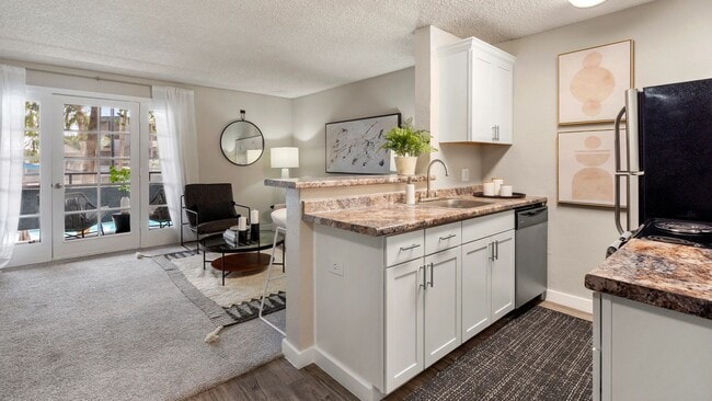 Prepare meals with ease in this stylish kitchen featuring modern cabinetry, generous counter space, and an open-concept layout that connects seamlessly to the living area.
