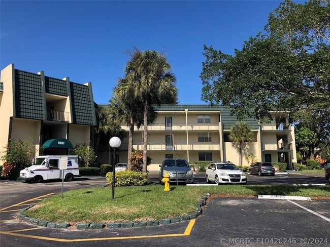 Building Photo - 9091 Lime Bay Blvd Unit 203