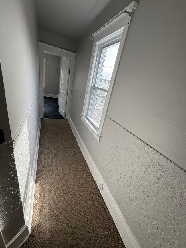 Hallway to front living room - 306 W Camplain Rd Unit Floor 2