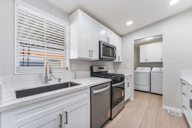 Photo - Welcome to this beautifully upgraded 3-bed, 2-bath single-family home in the heart of Sunrise Manor!