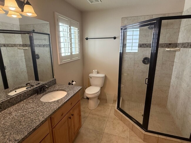 Photo - Beautiful patio home with 2 car garage, central air, fenced yard and covered patio