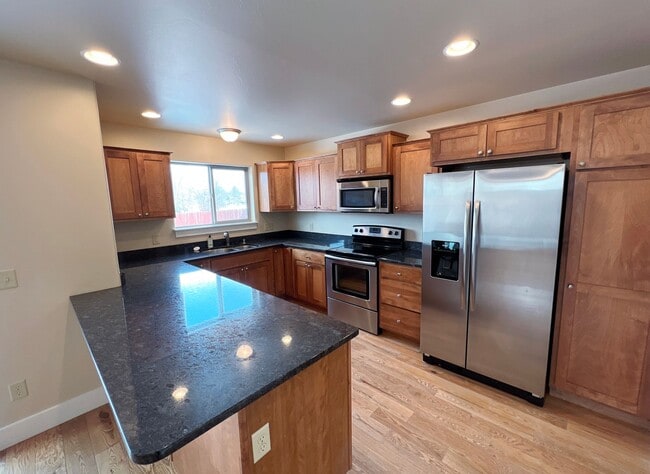 Photo - 3-Bedroom Townhome with Double Garage & Private Fenced Yard