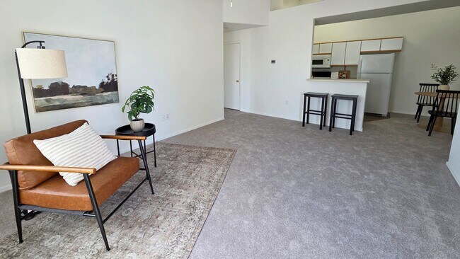 This expansive living area offers the perfect blend of comfort and functionality. Thoughtfully designed with ample natural light and an open layout, it's an ideal setting for both everyday living and hosting guests.