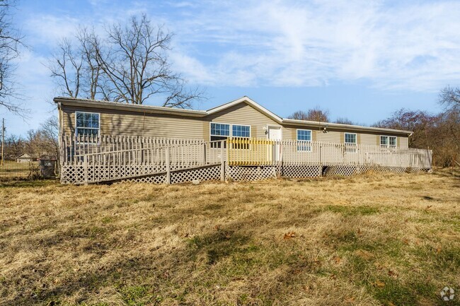 Building Photo - Spacious 4-Bedroom Home in Cave Springs – ...