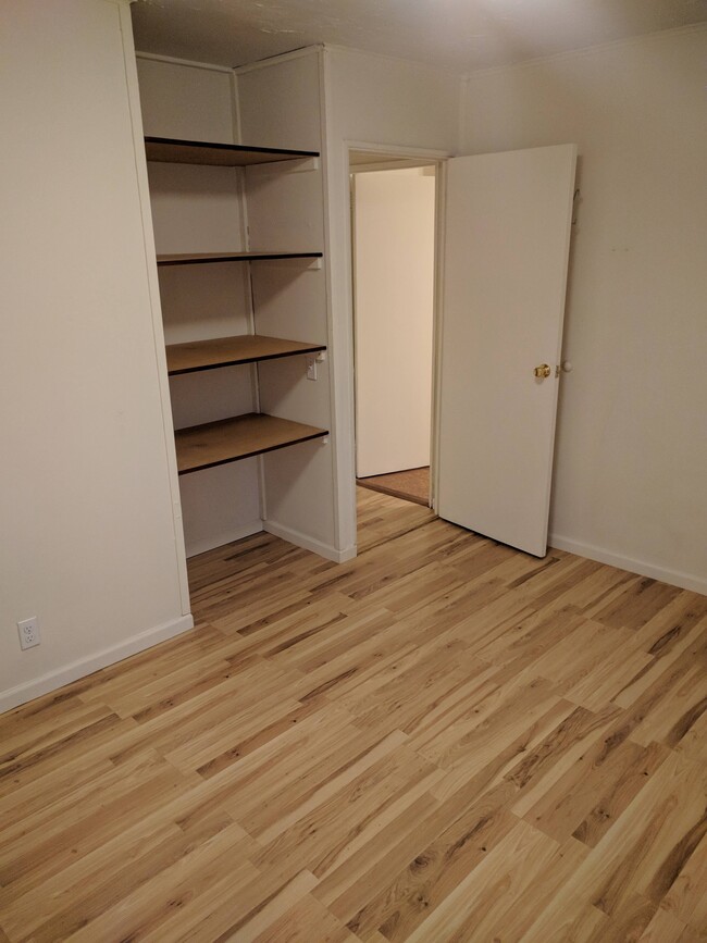 Shelving in closet of the second bedroom. - 4225 Sheffield Road House