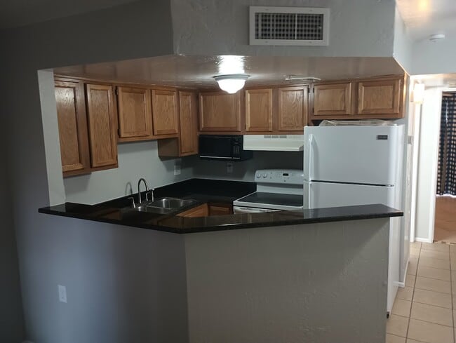 Kitchen -New granite counter tops - 12221 W Bell Rd Unit 182