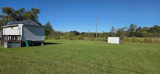 Photo - Tiny home with large yard