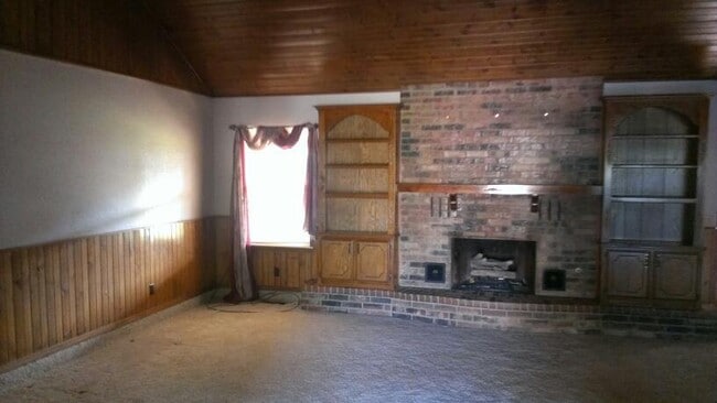 Photo - 3 car garage, corner lot, huge living with fireplace and covered patio in Moore School district