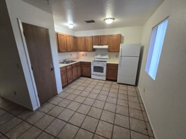 Photo - TRIPLEX 2BD/1BA COMING SOON!!! SPACIOUS BACKYARD!!