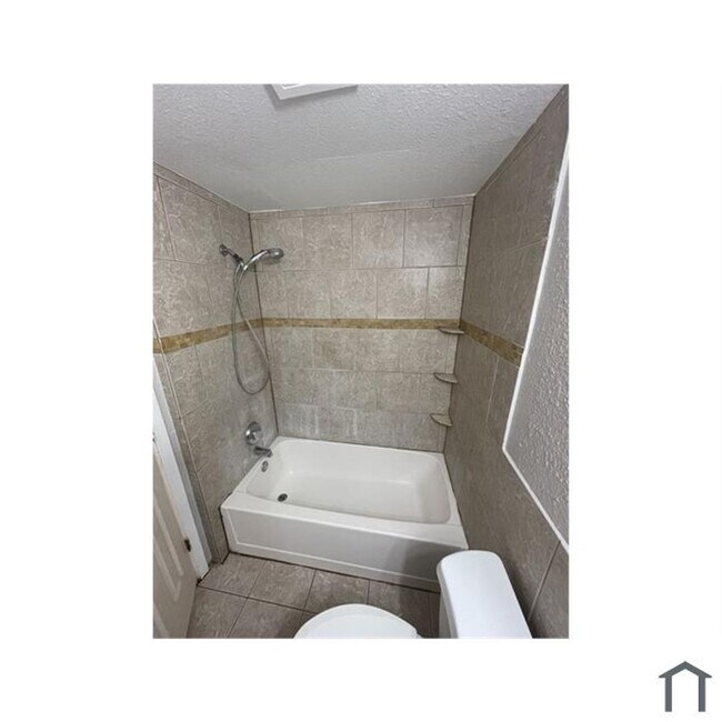 Photo - Discover your dream home in this beautifully renovated four-bedroom, two-bathroom house.