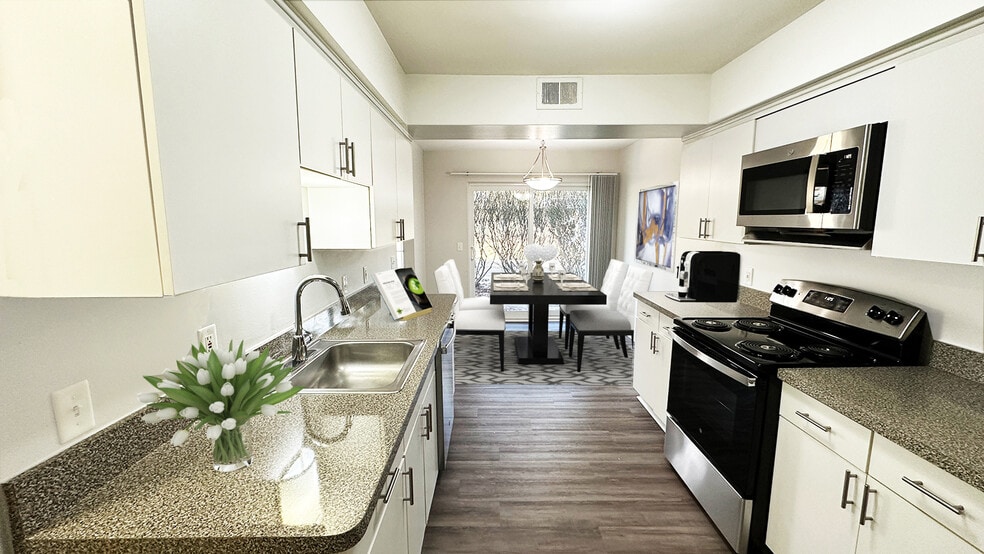 Large, full-featured kitchen with white modern cabinetry
