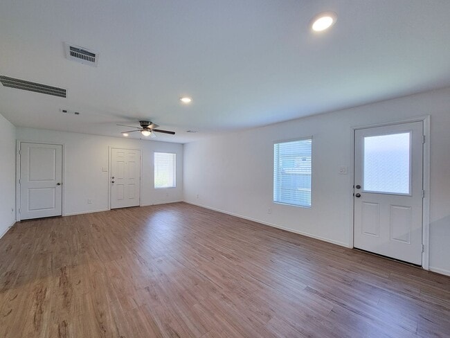 Photo - This single-story home has a comfortable layout with three bedrooms and a living area all on one ...