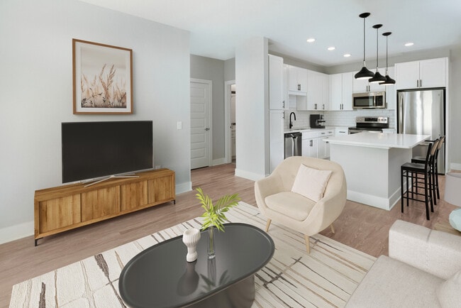 Kitchen, living, and dining areas with hard surface flooring