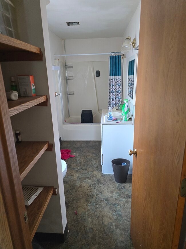 bathroom shower over tub - 2112 Clarence Ave Apartments Unit Upper