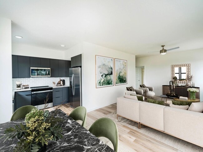 Stylish living and dining spaces designed for comfort and ease, all just moments from Tampa’s Encore District at Modera Encore. - Modera Encore