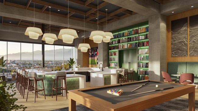 Take part in friendly competition in the clubroom with billiards. - Modera Scottsdale Apartments