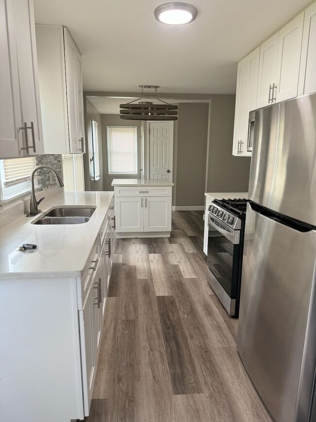 Building Photo - To apply please visit our website www.dadpropertiesnwi.com