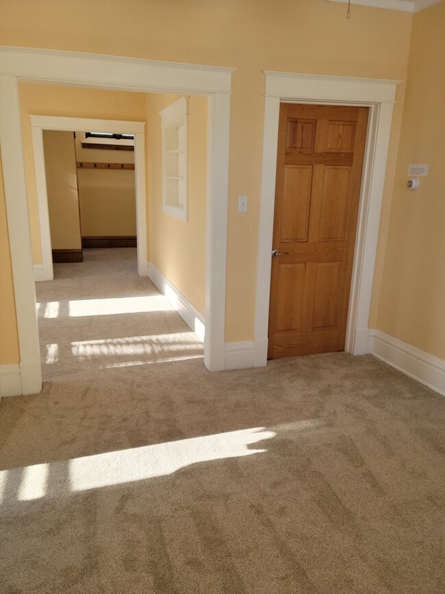 Dining room (looking through living room to entryway) - 100 Oxford St N Unit Apartment 1