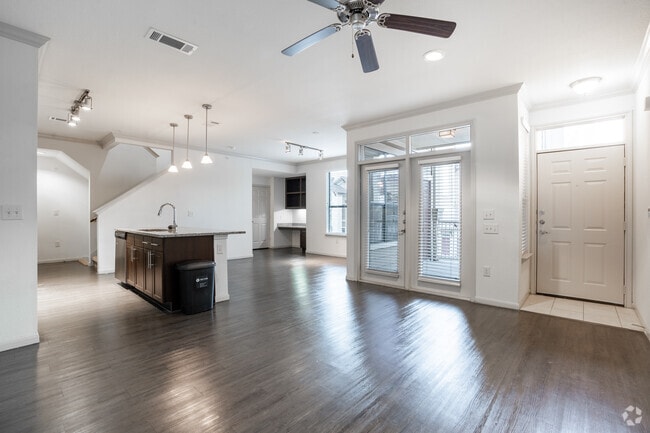 3BR, 2.5BA - 1,563SF - Living Room - The Crossing at Katy Ranch Apartments