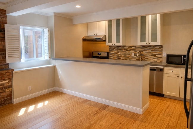 Updated kitchen with stainless appliances and bar height counter - 1111 North Rd