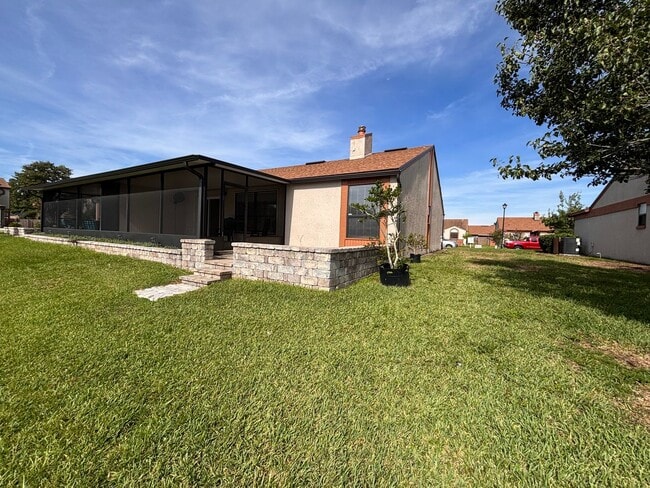 Photo - 2 Bed 2 Bath Luxury Waterfront Townhome with Screened Lanai & Garage!