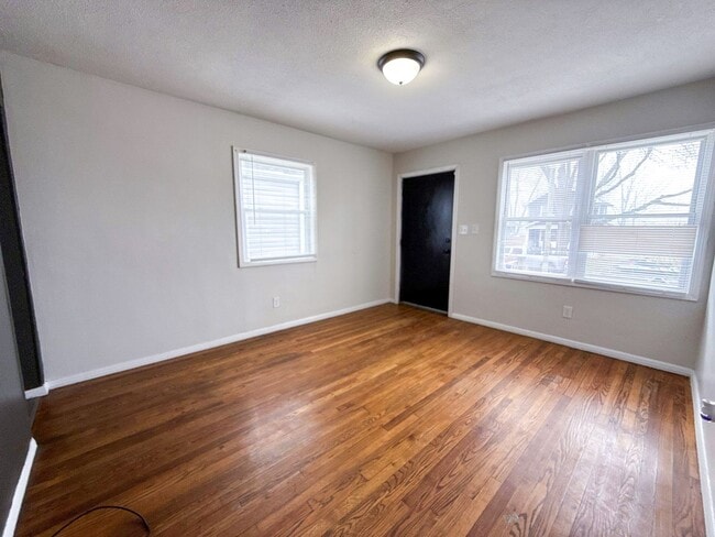 Photo - Move-In Ready 2BR Home w/ Refinished Hardwood Floors + Bonus Room Basement!