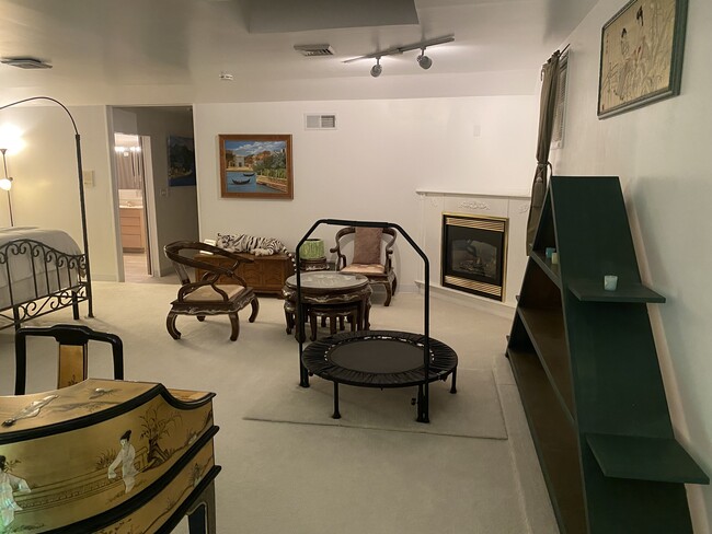 Sitting area in master bedroom with gas fireplace. - 720 State St Apartment Unit 1A