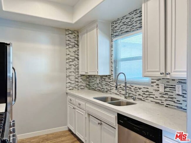 Building Photo - 14430 Benefit St Unit 103