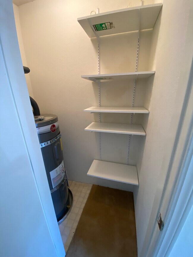 Pantry off kitchen with water heater - 445 Willow Ave Unit 445