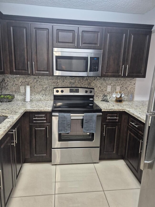 Building Photo - 7865 W 30th Ct Unit H-107 Rental