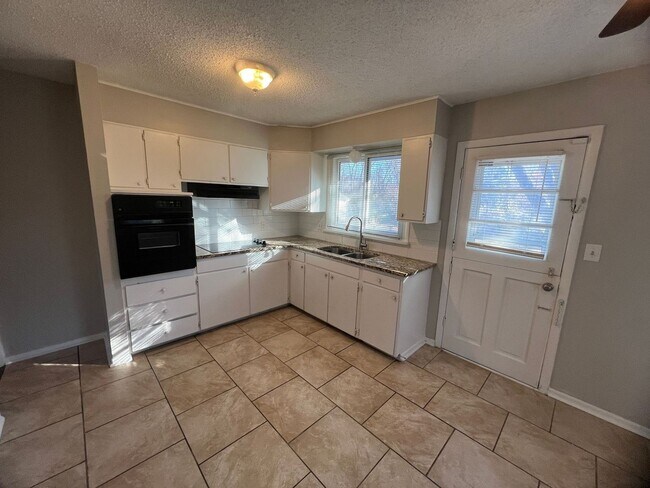 Photo - 3-Bedroom Home With Finished Basement and Storage Shed