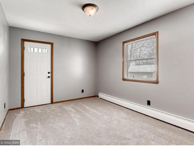 bedroom with balcony door shown - 136 7th Ave S