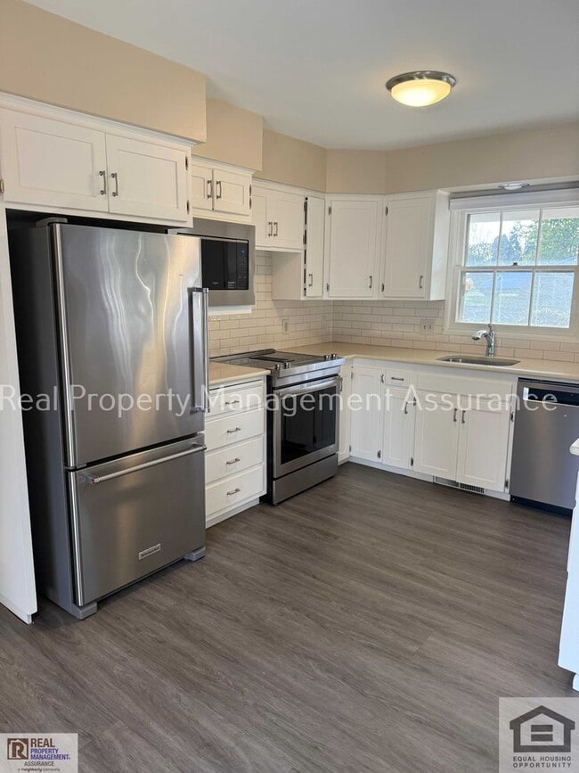 Photo - Attractive 4 bedroom/2 full bath single-level ranch style home