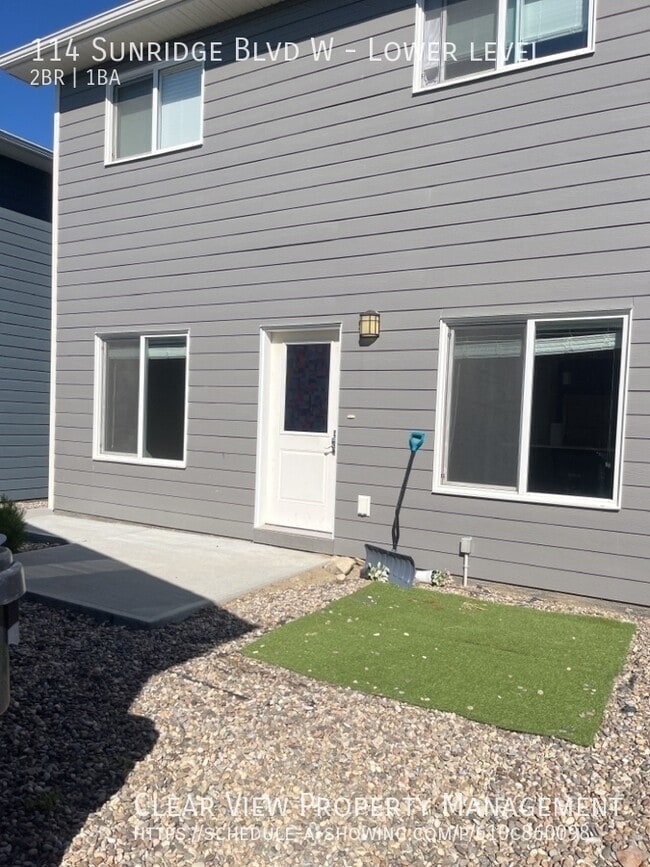 Photo - Amazing 2-bedroom, 1-bathroom suite with zero scaped yard! Unit Lower level