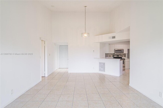 Photo - 9033 Wiles Rd Unit 303