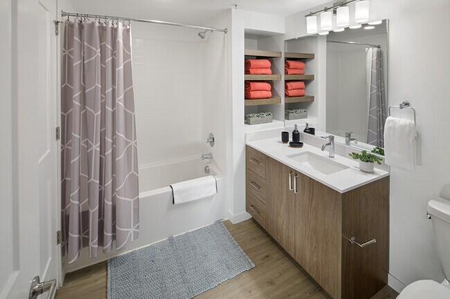 Modern bathrooms include soaking tubs with tile surround and built-in shelving